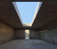Interior view of the space featuring a zenithal opening to the sky