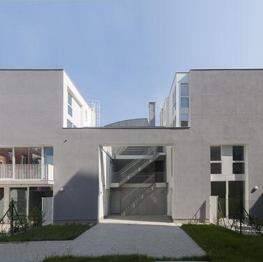 outside stairway splits the building into two volumes